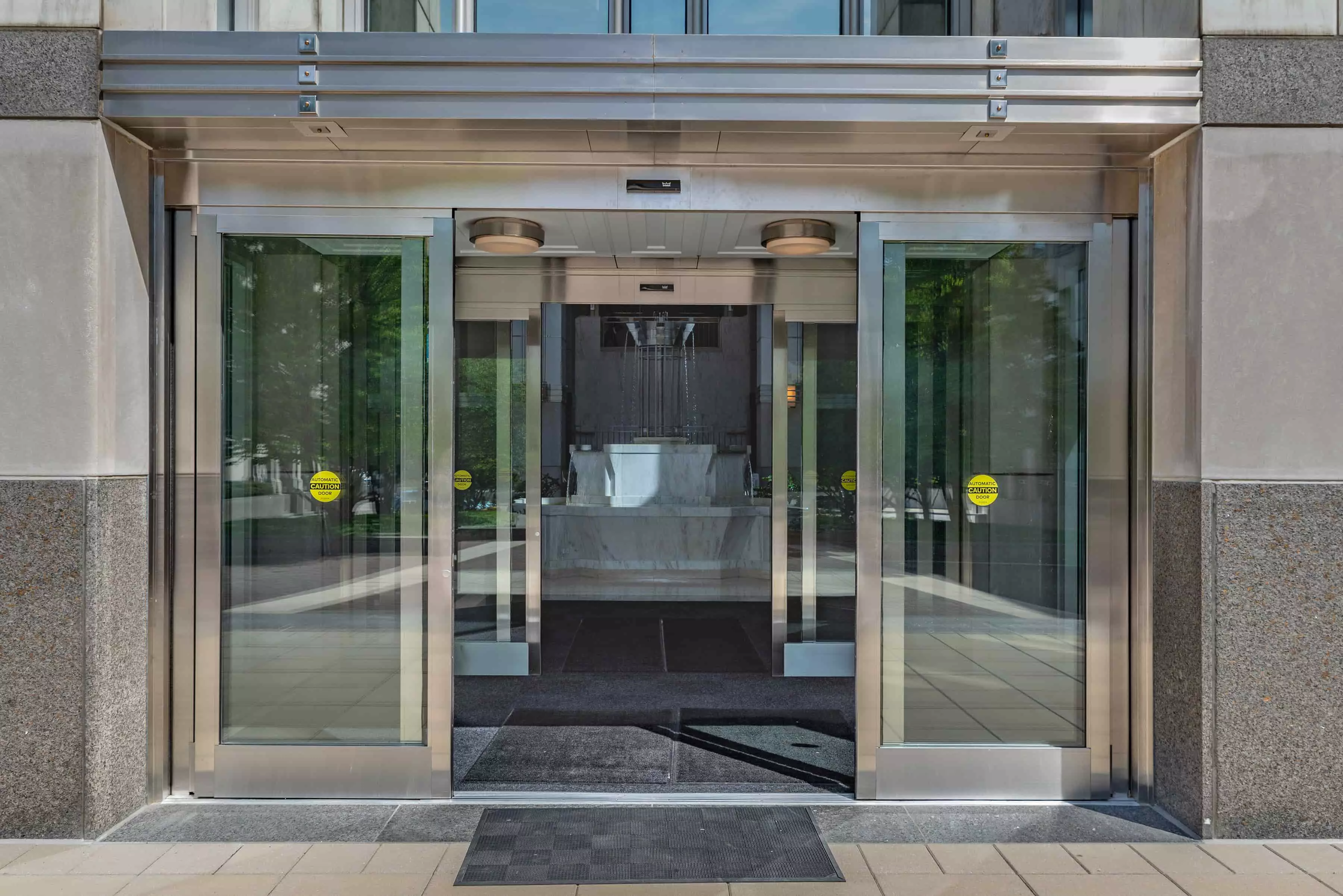 Automatic doors with fountain inside building