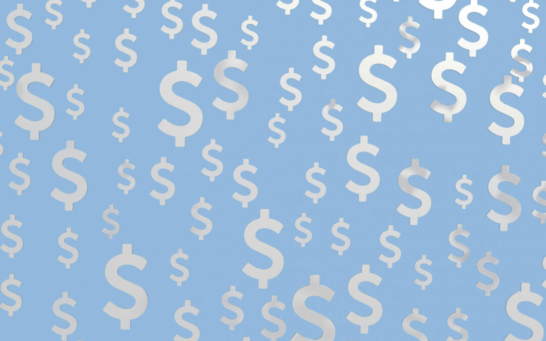 silver dollar signs on a light blue background